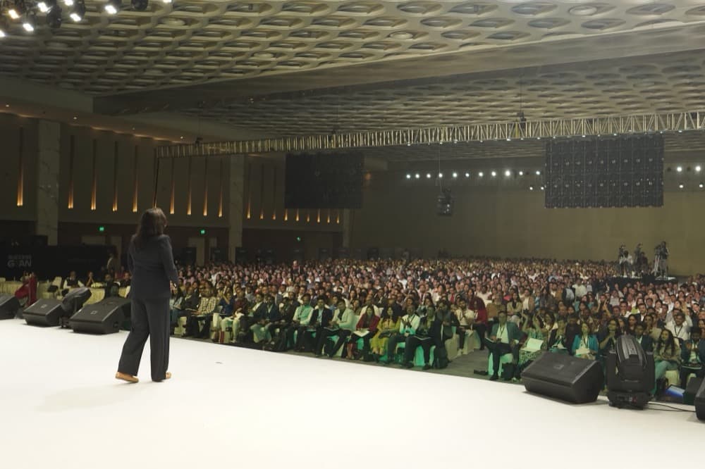 Maalica Ravikumar speaking to thousands from stage
